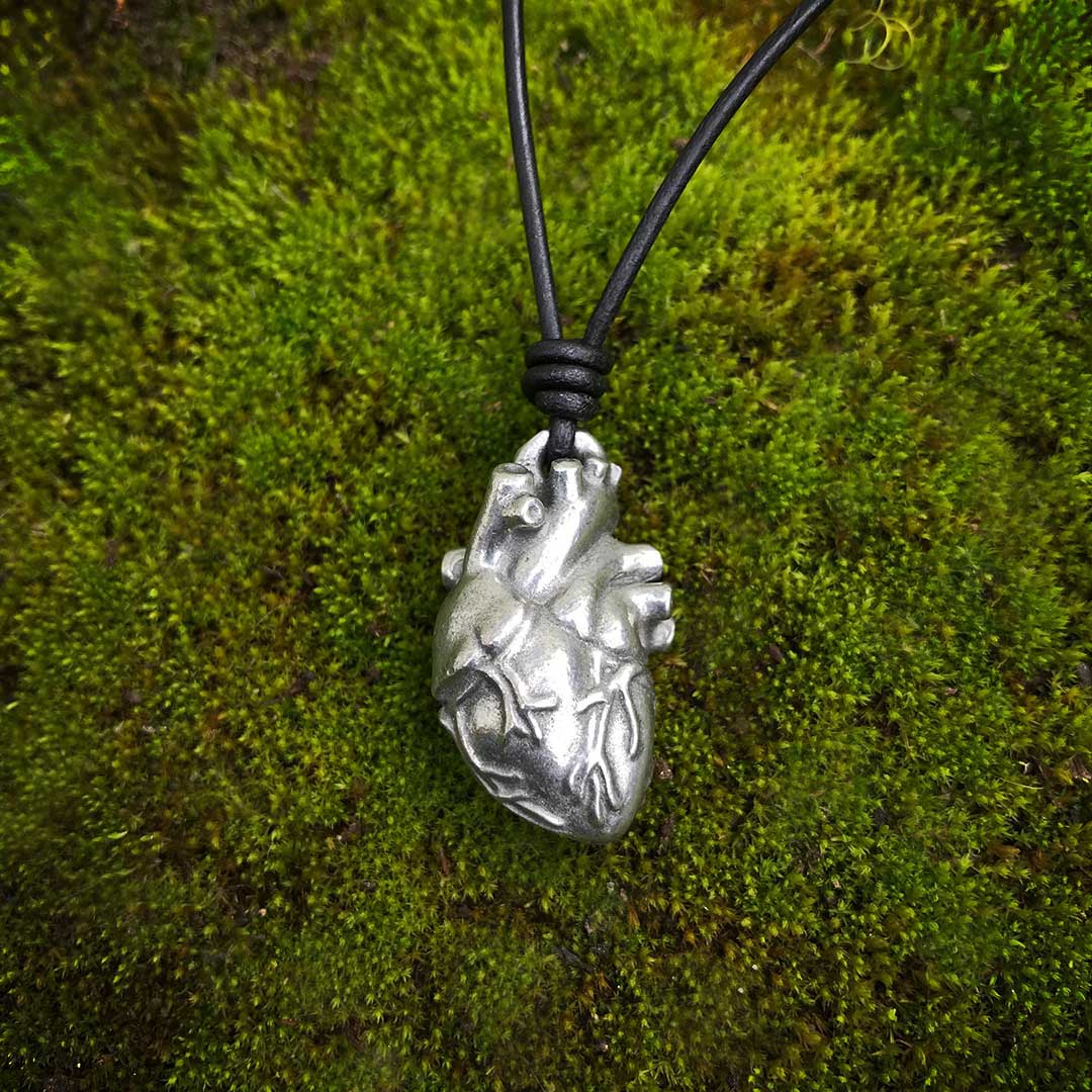 Pewter Anatomical Heart Necklace - Perfect science jewelry gift for nurses, doctors, med students, cardiologists, medical researchers, science teachers, and lovers. This pewter anatomically correct heart necklace has meticulously correct details, including the aorta, vena cava, pulmonary arteries and veins, and the finely branched coronary blood vessels. Pendant is small batch cast from genuine pewter and given an antique finish and  hung on an adjustable black leather cord.