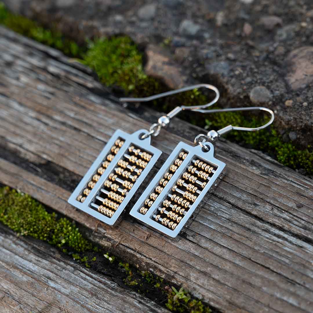 Abacus Earrings with moving gold beads. Great science jewelry gift for a mathematician, math teacher, or student! Each abacus measures 20 mm long, 12 mm wide and is made from steel with moving gold beads on surgical steel ear hooks.