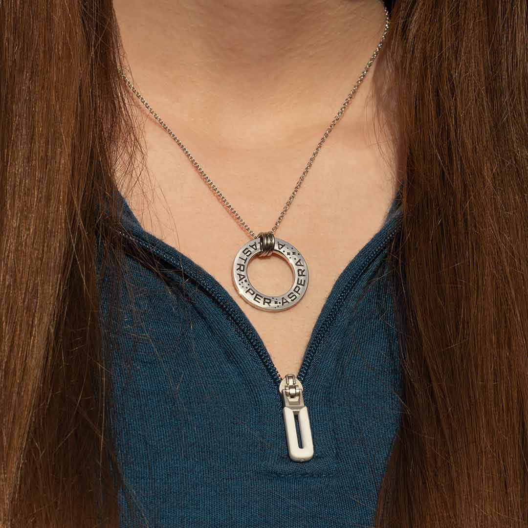 Ad Astra Per Aspera Necklace - Perfect science jewelry gift for space science enthusiasts, astronomy students &amp; instructors, and anyone with a dream to follow, despite the challenges. Steel disc pendant is engraved with the Latin phrase “AD ASTRA PER ASPERA”, which translates as “to the stars, through difficulties”. Each word is framed with tiny stars, and the pendant freely moves within three steel jump rings and is hung on an adjustable 16-18 inch steel chain.