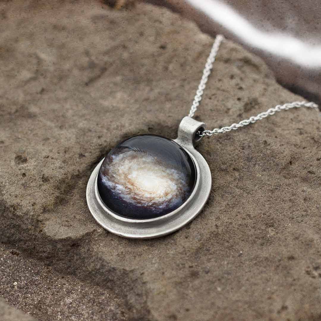 Galaxy Necklace - space science jewelry. Great gift for an astronomer, star gazer, science teacher, or scientist. This necklace encases a galaxy under a glass dome.