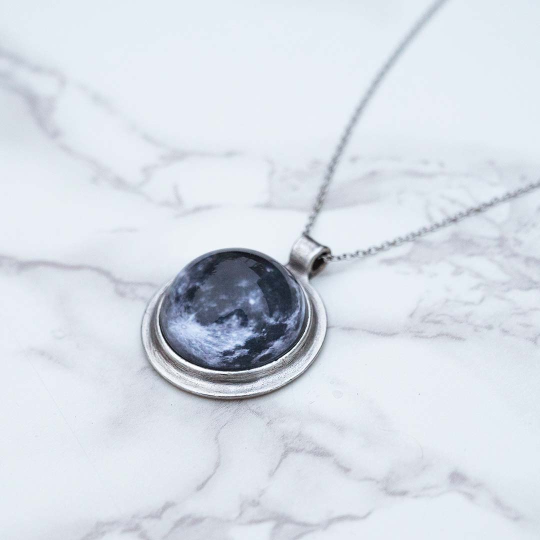 Moon Necklace - space science jewelry for astronomy. Great gift for an astronomer, star gazer, science teacher, or lunar observer. The pendant is an image of the moon, encased in a glass dome.