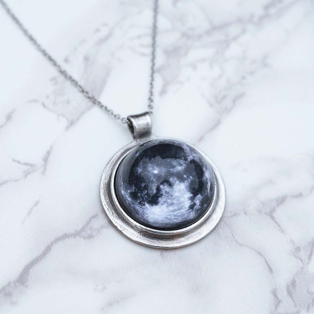 Moon Necklace - space science jewelry for astronomy. Great gift for an astronomer, star gazer, science teacher, or lunar observer. The pendant is an image of the moon, encased in a glass dome.