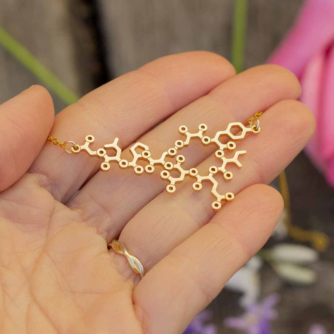 Gold oxytocin necklace with gold chain -- a wonderful science jewelry gift for mothers, breastfeeding advocates, midwives, doulas, obstetricians, and sweethearts. Oxytocin is a social bonding hormone that facilitates childbirth, love, and friendship.