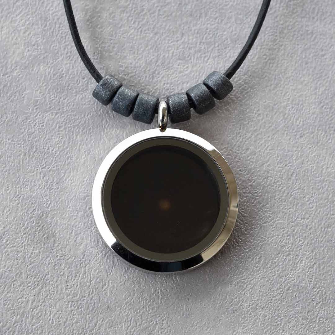 Universe Necklace - science jewelry for astronomers, science teachers, star gazers, and astronomy and space enthusiasts. This one has a leather cord with black ceramic beads on each side of the pendant.
