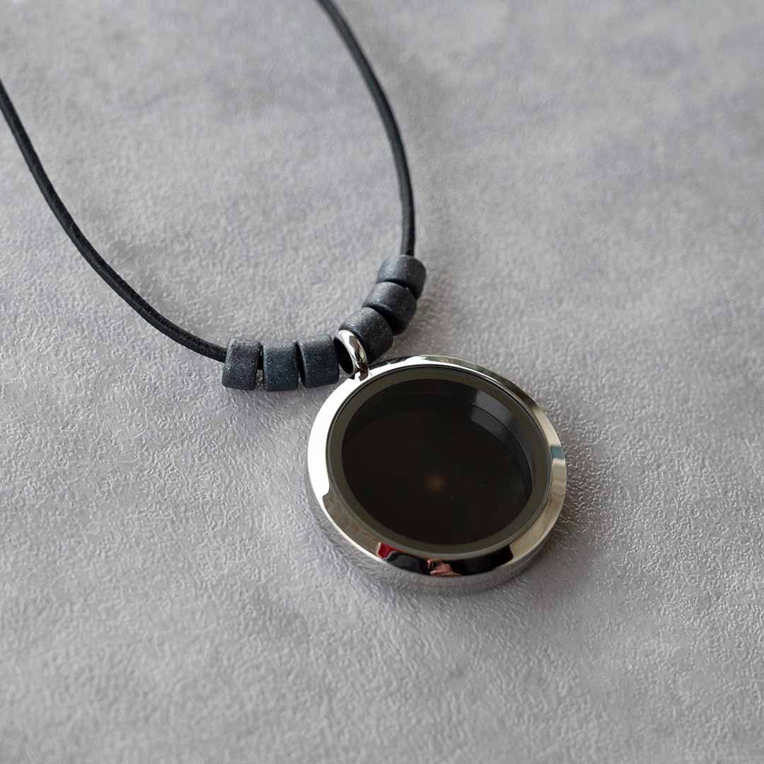 Universe Necklace - science jewelry for astronomers, science teachers, star gazers, and astronomy and space enthusiasts. This one has a leather cord with black ceramic beads on each side of the pendant.