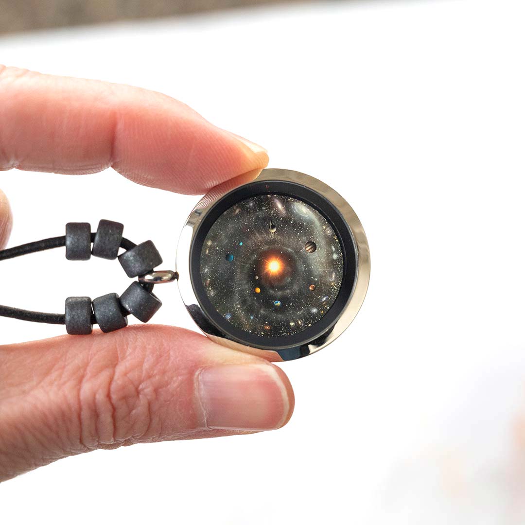 Universe Necklace - science jewelry for astronomers, science teachers, star gazers, and astronomy and space enthusiasts. This one has a leather cord with black ceramic beads on each side of the pendant.