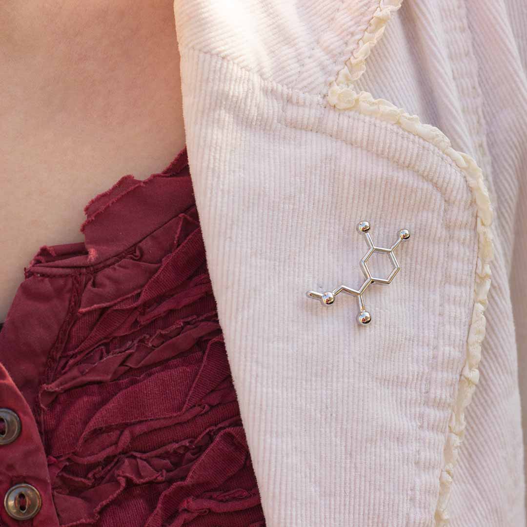 Adrenaline Pin - Great science jewelry gift for adventurers, sky divers, rock climbers, neurologists, ER doctors, heart specialists, EpiPen carriers, cardiac arrest survivors, and anyone who appreciates the role this neurotransmitter plays in their life. Pin measures 1.7cm long and 3cm wide. It comes with a metal pin clasp and is made from a zinc alloy.