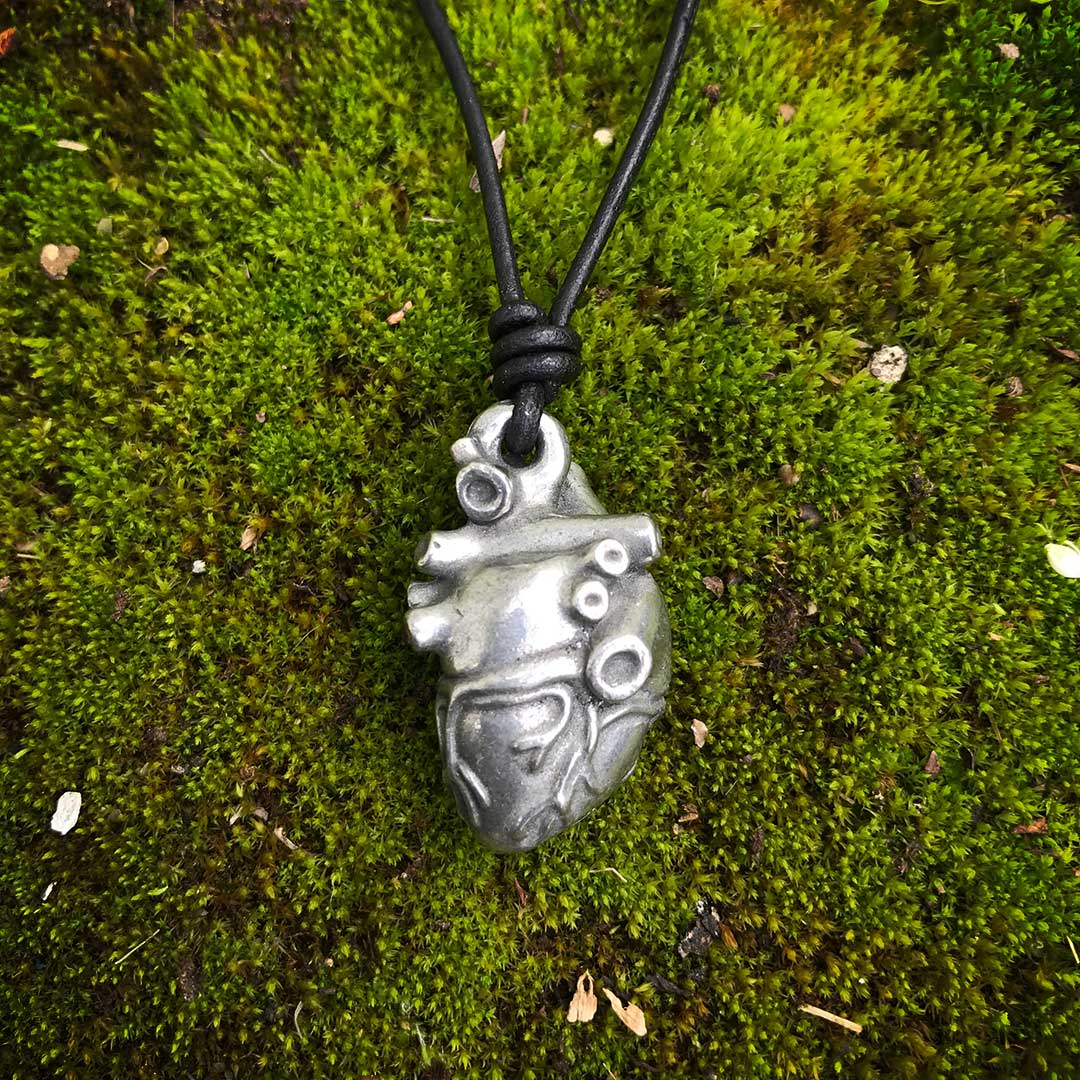 Pewter Anatomical Heart Necklace - Perfect science jewelry gift for nurses, doctors, med students, cardiologists, medical researchers, science teachers, and lovers. This pewter anatomically correct heart necklace has meticulously correct details, including the aorta, vena cava, pulmonary arteries and veins, and the finely branched coronary blood vessels. Pendant is small batch cast from genuine pewter and given an antique finish and  hung on an adjustable black leather cord.