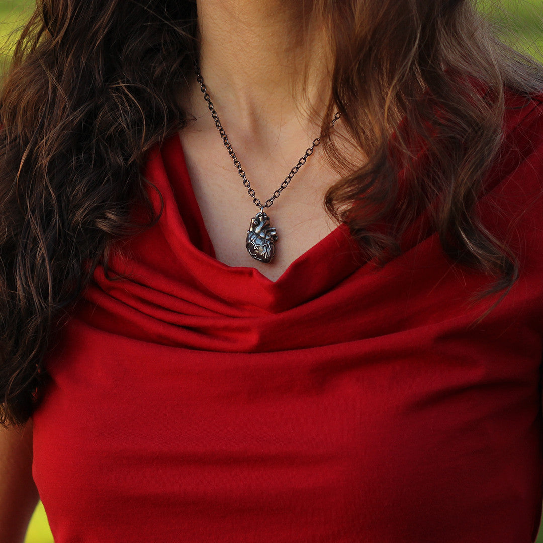 Pewter Anatomical Heart Necklace - Perfect science jewelry gift for nurses, doctors, med students, cardiologists, medical researchers, science teachers, and lovers. This pewter anatomically correct heart necklace has meticulously correct details, including the aorta, vena cava, pulmonary arteries and veins, and the finely branched coronary blood vessels. Pendant is small batch cast from genuine pewter and given an antique finish and  hung on an 18 inch or 32 inch heavyweight gunmetal chain.