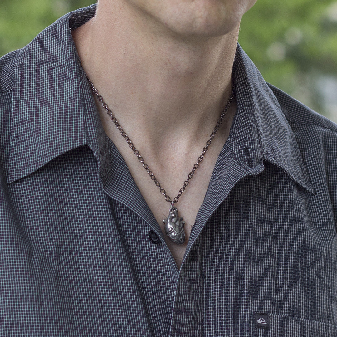 Pewter Anatomical Heart Necklace - Perfect science jewelry gift for nurses, doctors, med students, cardiologists, medical researchers, science teachers, and lovers. This pewter anatomically correct heart necklace has meticulously correct details, including the aorta, vena cava, pulmonary arteries and veins, and the finely branched coronary blood vessels. Pendant is small batch cast from genuine pewter and given an antique finish and  hung on an 18 inch or 32 inch heavyweight gunmetal chain.