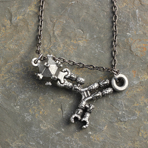 Antibody and Virus Necklace - Perfect science jewelry gift for biologists, researchers, immunologists, doctors, nurses, med students, and science lovers. Beautifully detailed antibody and virus pendants actually fit together in the antigen binding site and are pewter cast from hand-carved models with details of amino acid chains, regions, and disulfide bonds. The larger piece is about 1.5 inches at its widest point. Pendants are strung together on an 18 or 32 inch gunmetal chain.