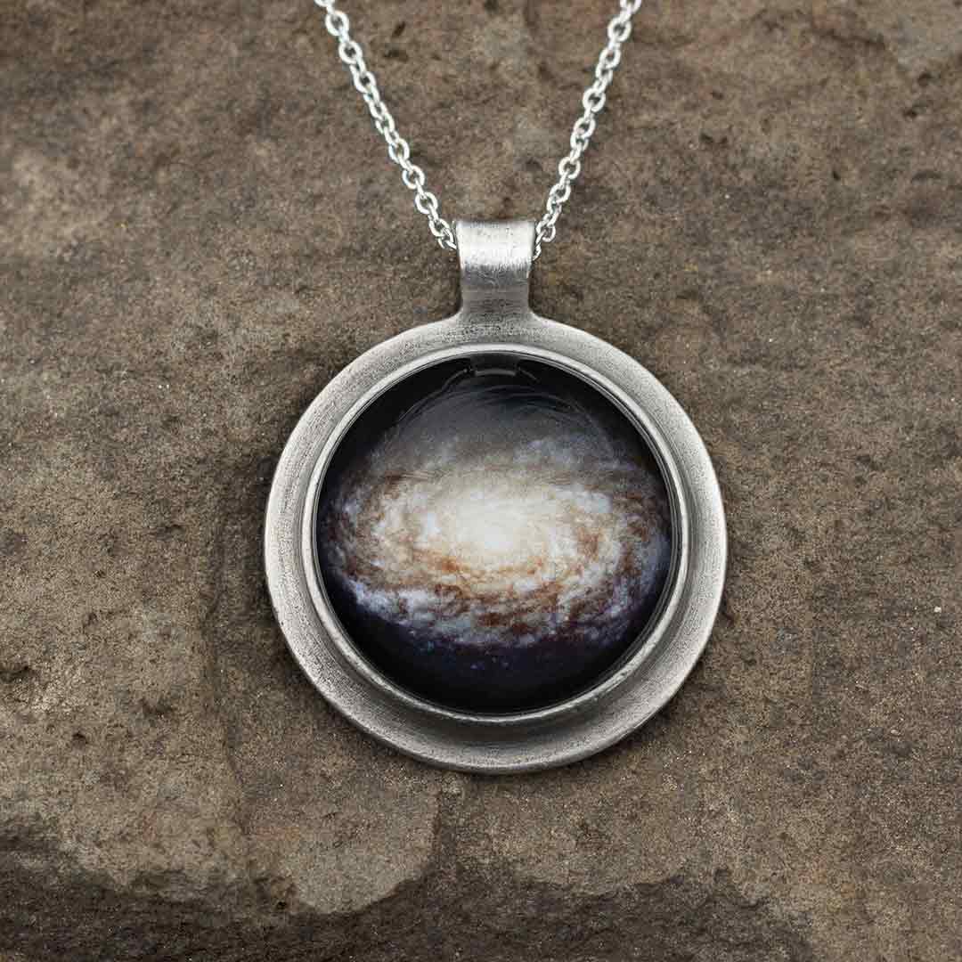 Galaxy Necklace - space science jewelry. Great gift for an astronomer, star gazer, science teacher, or scientist. This necklace encases a galaxy under a glass dome.