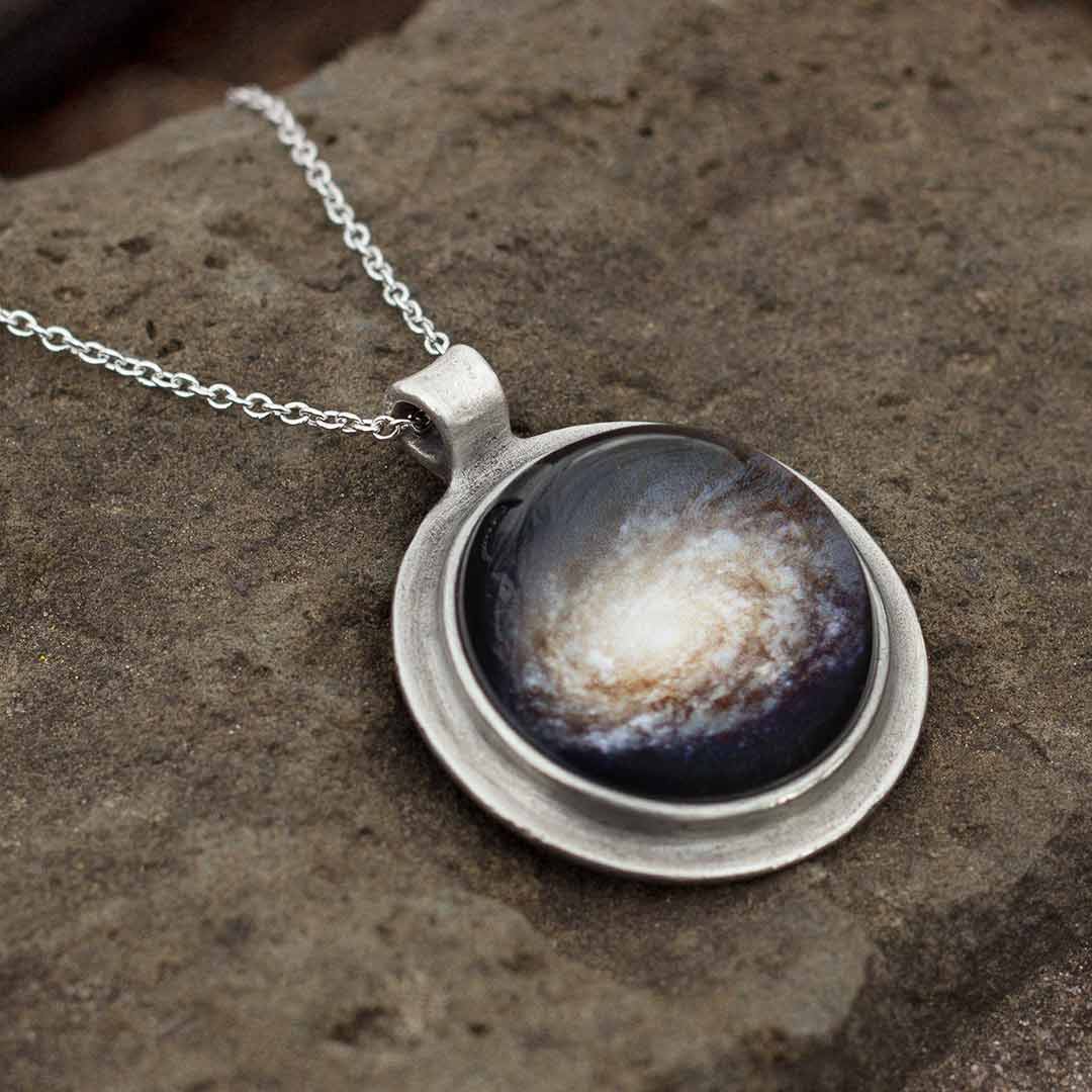 Galaxy Necklace - space science jewelry. Great gift for an astronomer, star gazer, science teacher, or scientist. This necklace encases a galaxy under a glass dome.