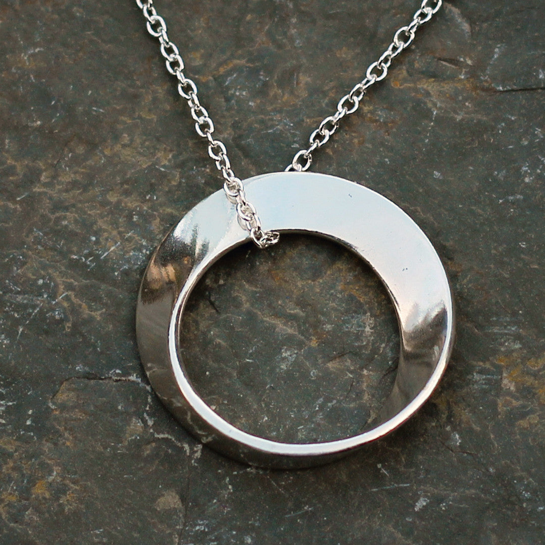 Mobius Necklace on a silver chain - math jewelry, great gift for mathematics students and teachers, artists, and basically anyone