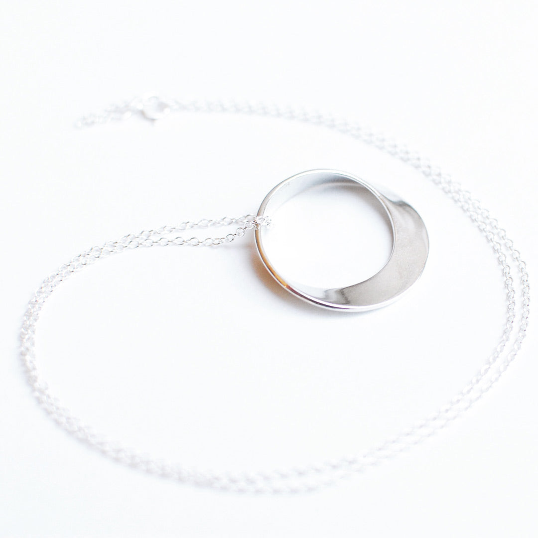 Mobius Necklace on a silver chain - math jewelry, great gift for mathematics students and teachers, artists, and basically anyone