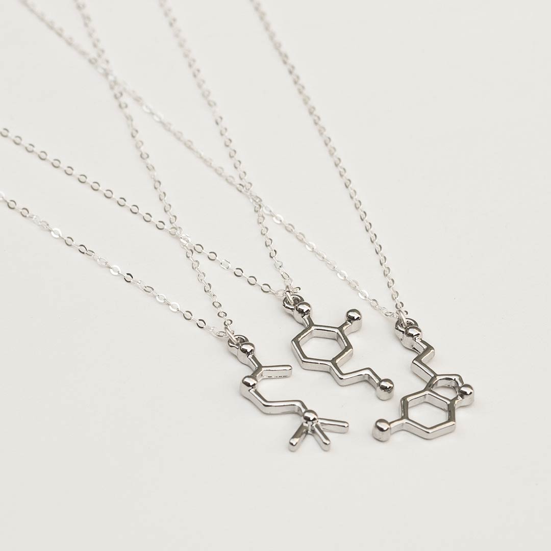 Neurotransmitter molecule necklace - acetylcholine, dopamine, and serotonin. Biology science jewelry that makes a great gift for a scientist, student, or teacher.