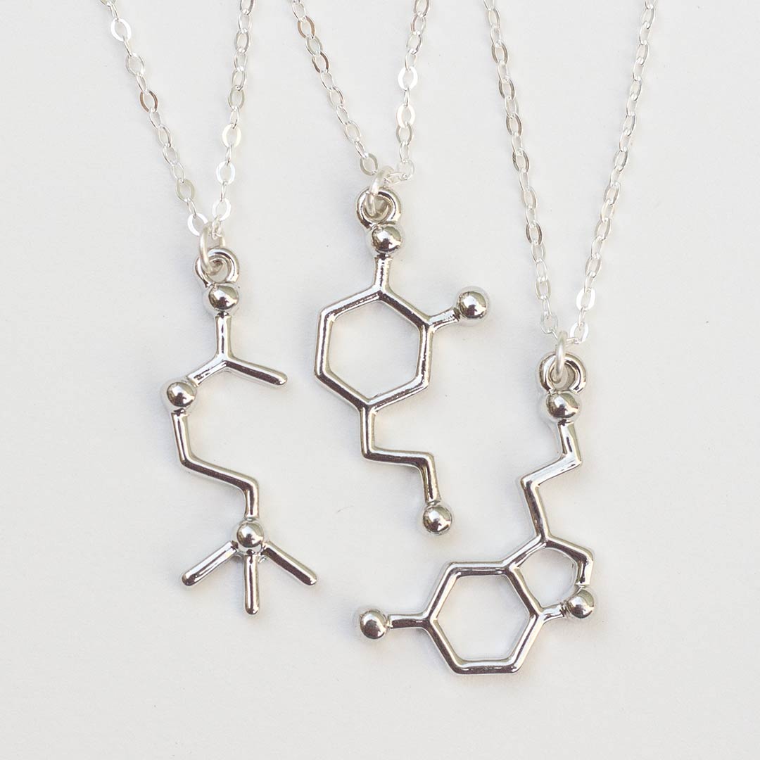 Neurotransmitter molecule necklace - acetylcholine, dopamine, and serotonin. Biology science jewelry that makes a great gift for a scientist, student, or teacher.