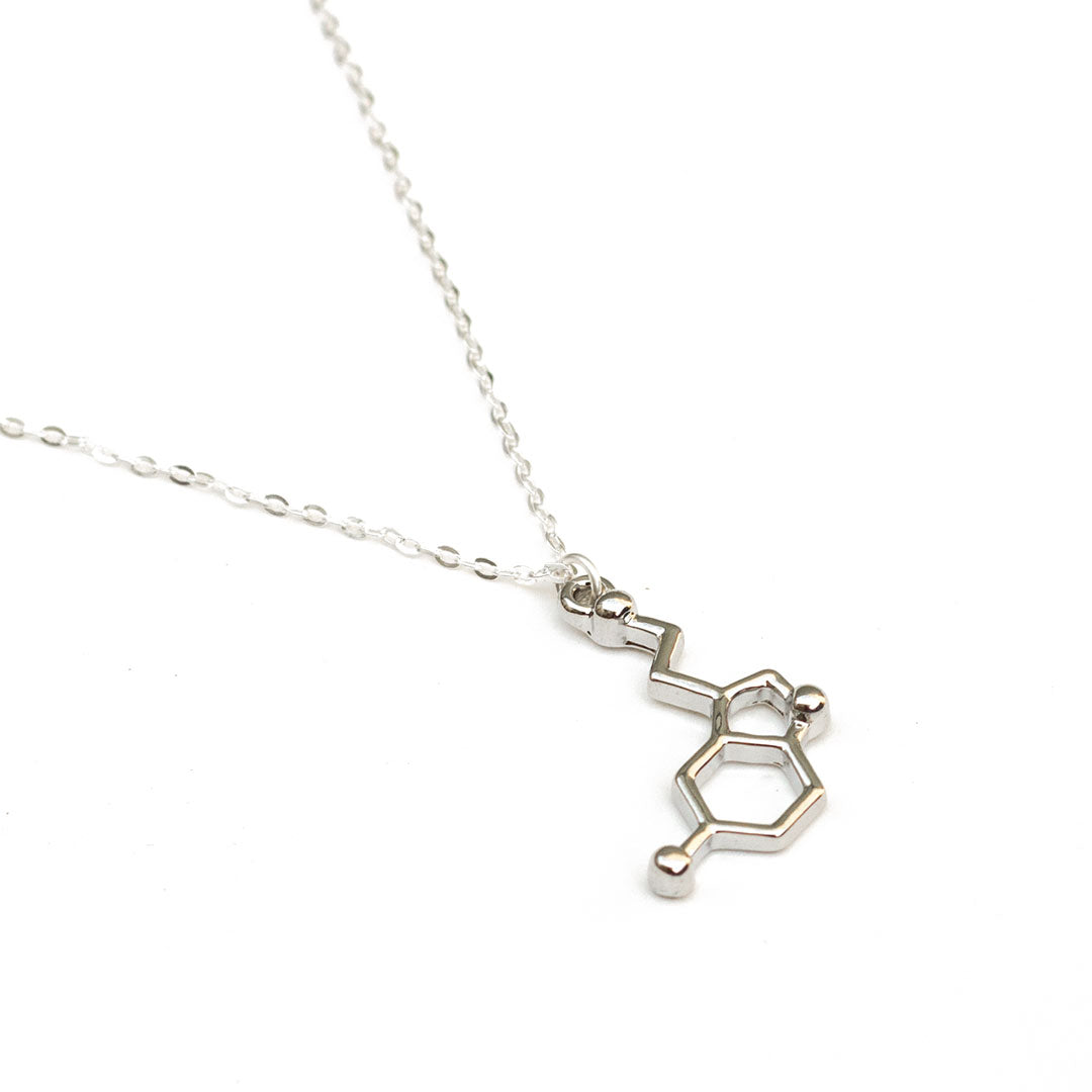 Neurotransmitter molecule serotonin necklace. Biology science jewelry that makes a great gift for a scientist, student, or teacher.