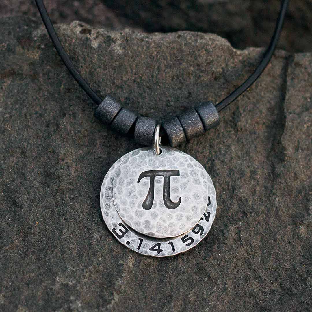 Pi math necklace showing the pi symbol on one disc and pi to 35 decimal places on the second disc. Great gift for a mathematician, a student or a teacher of mathematics. 