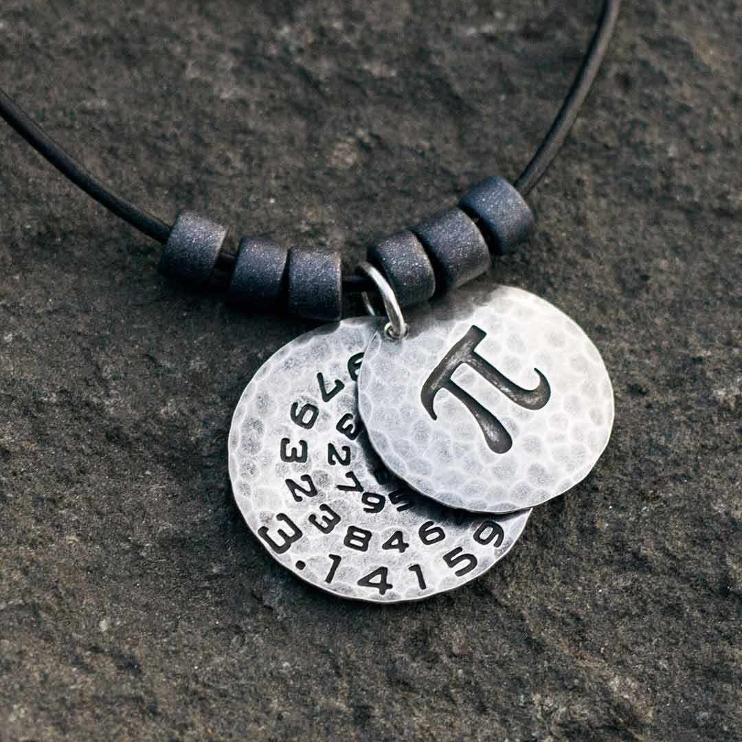 Pi math necklace showing the pi symbol on one disc and pi to 35 decimal places on the second disc. Great gift for a mathematician, a student or a teacher of mathematics. 