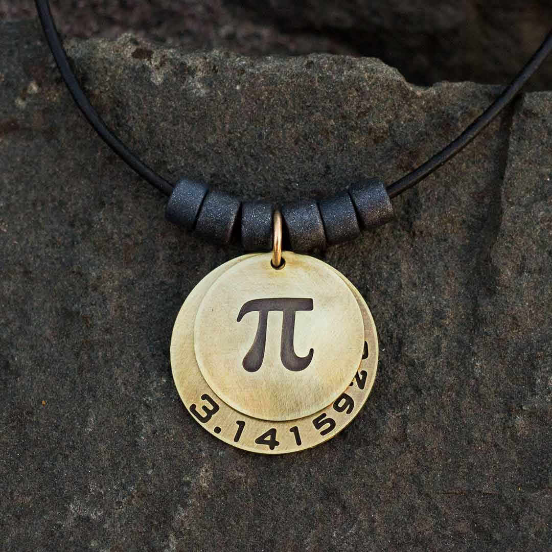 Pi math necklace showing the pi symbol on one disc and pi to 35 decimal places on the second disc. Great gift for a mathematician, a student or a teacher of mathematics. 