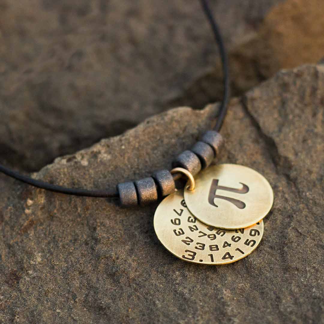 Pi math necklace showing the pi symbol on one disc and pi to 35 decimal places on the second disc. Great gift for a mathematician, a student or a teacher of mathematics. 