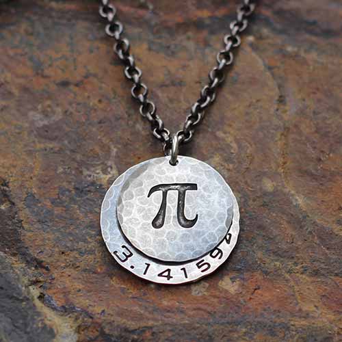 Pi math necklace showing the pi symbol on one disc and pi to 35 decimal places on the second disc. Great gift for a mathematician, a student or a teacher of mathematics. 