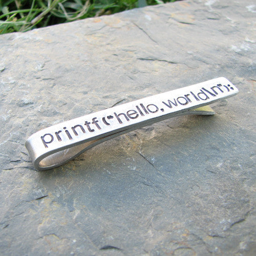 Printf(&quot;hello,world\n&quot;); tie bar - perfect science jewelry gift for computer scientists, programmers, and technology teachers and students. Tie bar is made from sturdy hand stamped aluminum.