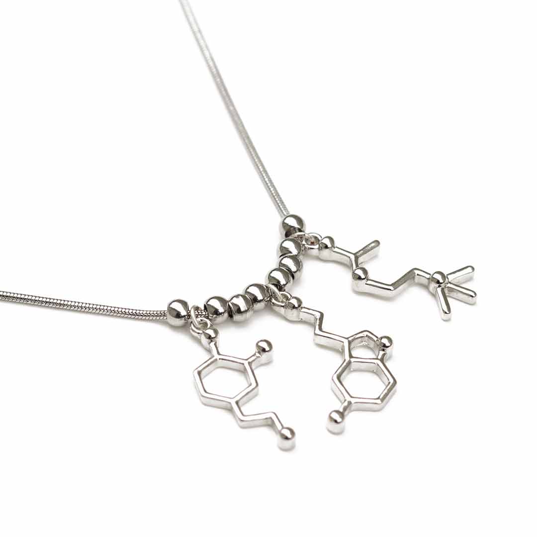 Neurotransmitter molecule necklace that includes dopamine, serotonin, and acetylcholine. Beautiful science jewelry and great gift for a teacher, scientist, or biology student.