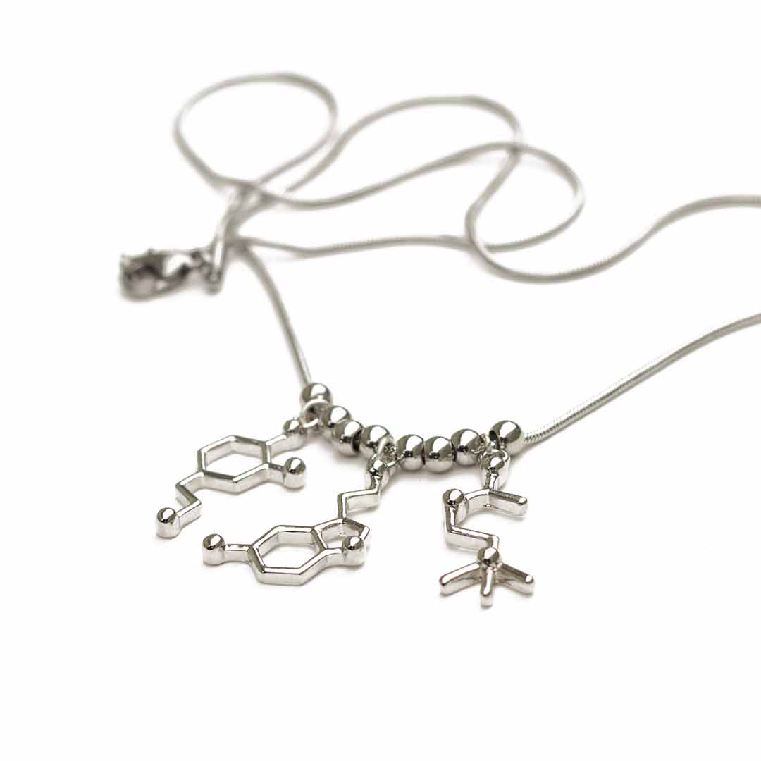 Neurotransmitter molecule necklace that includes dopamine, serotonin, and acetylcholine. Beautiful science jewelry and great gift for a teacher, scientist, or biology student.