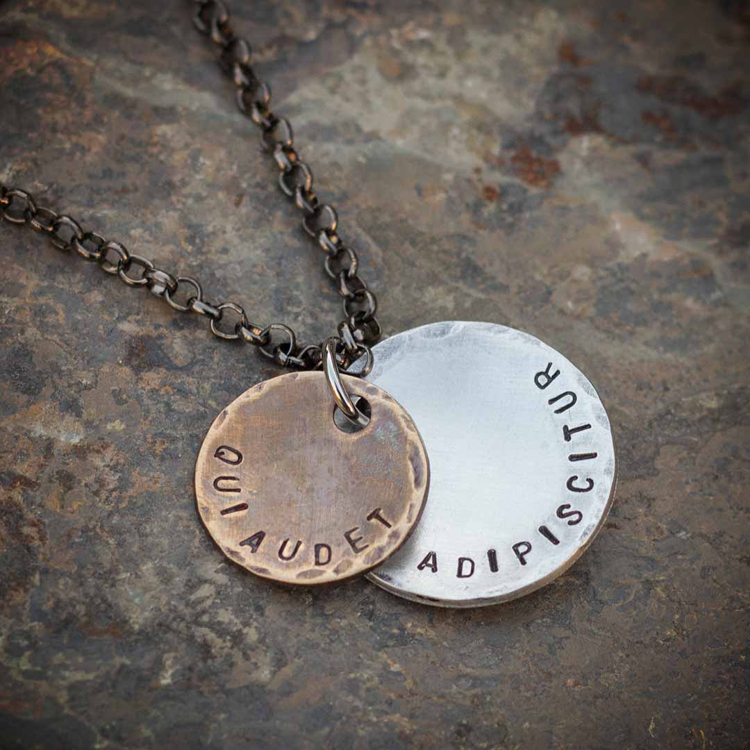 Qui Audet Adipiscitur - &quot;She Who Dares, Wins&quot; Necklace - Perfect science jewelry for innovators, experimenters, entrepreneurs,  and anyone with a dream. Makes a beautiful gift for graduations, birthdays, or starting a new challenging venture. Hand-stamped weathered bronze and aluminum discs, hung from a 28 inch gunmetal chain.