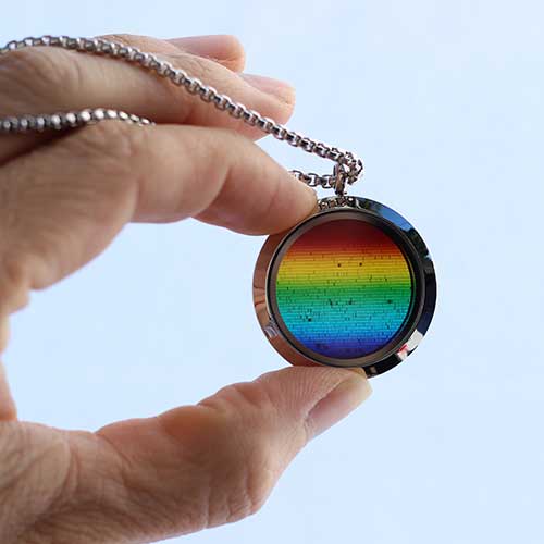 Solar spectrum necklace - science jewelry for astronomers, science teachers, star gazers, astronomy enthusiasts, and LGBT+ advocates.
