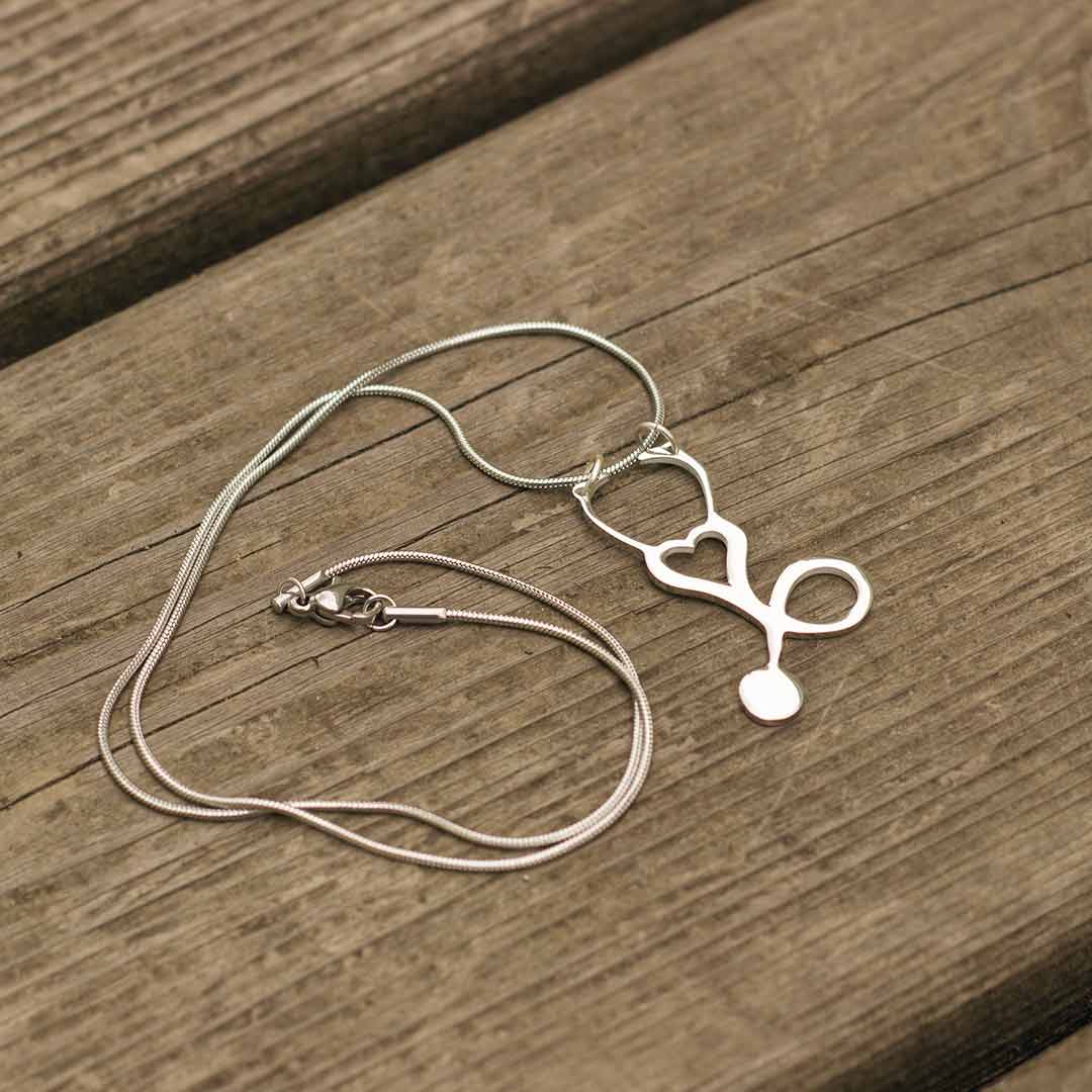 Stethoscope and Syringe Necklace - great jewelry gift for a nurse, pediatrician, doctor, or med student.